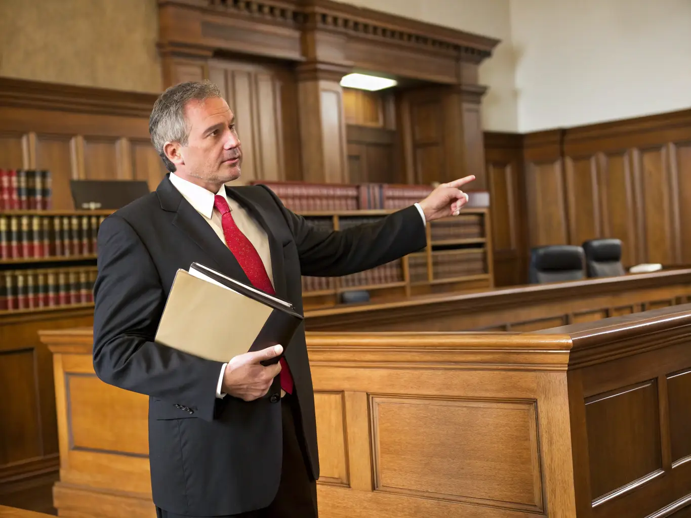 A determined lawyer standing in a courtroom, advocating for their client with conviction, representing strong legal representation in litigation.