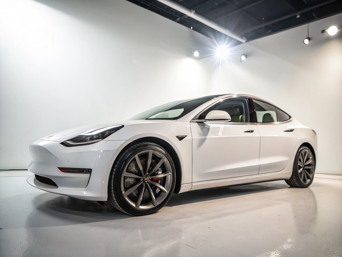 Tesla Model 3 sports sedan side profile against dark backdrop