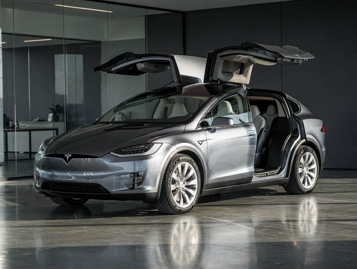 Tesla Model X luxury SUV in profile showcasing falcon-wing silhouette